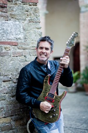 Mad Guitarist Plays Guitar In A Corner On The Street
